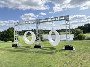 Outdoor truss structures goalpost with hanging ring swings on steel base plates